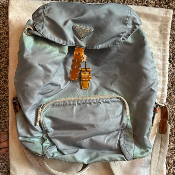 Prada back pack.  Comes in Prada bag. Lightly used.  One visible marking - Picture 1 of 7